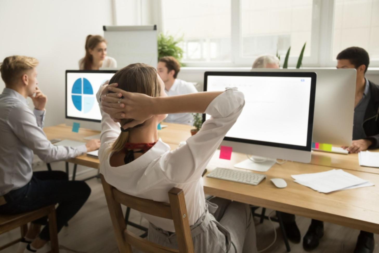 Person reviewing financial statements at desk